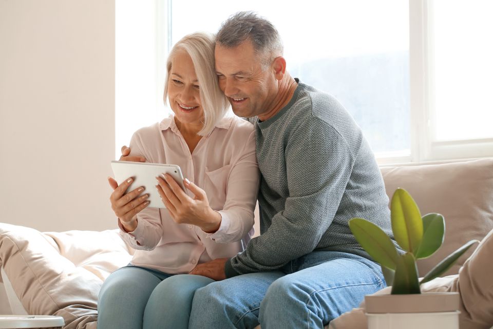 Senior couple reviewing Medicare information together on a tablet