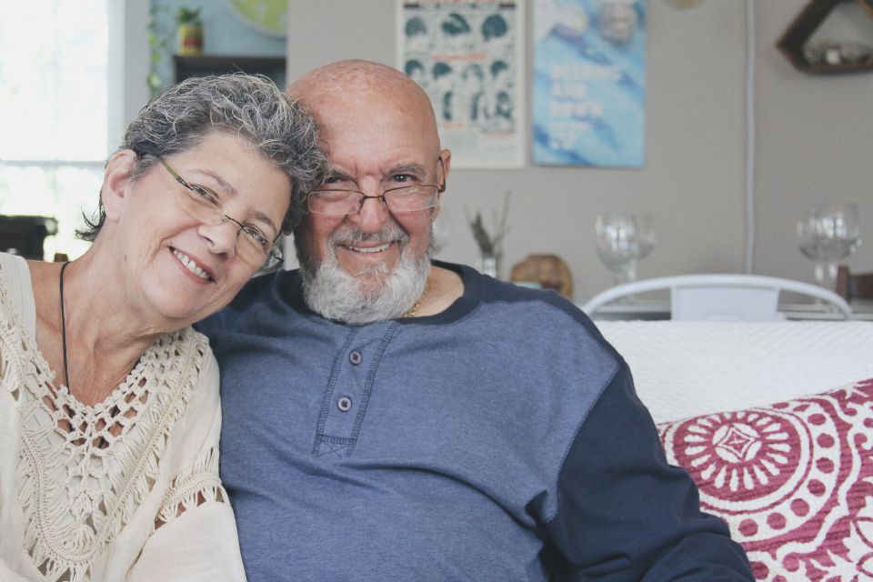 Happy senior couple relaxing together at home