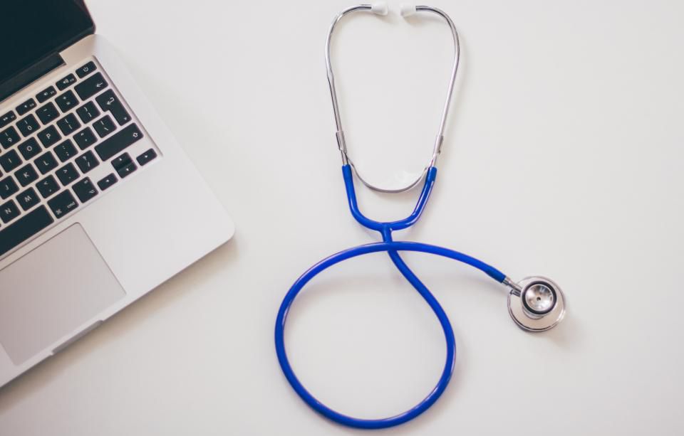 Stethoscope on a laptop used for electronic claim submission